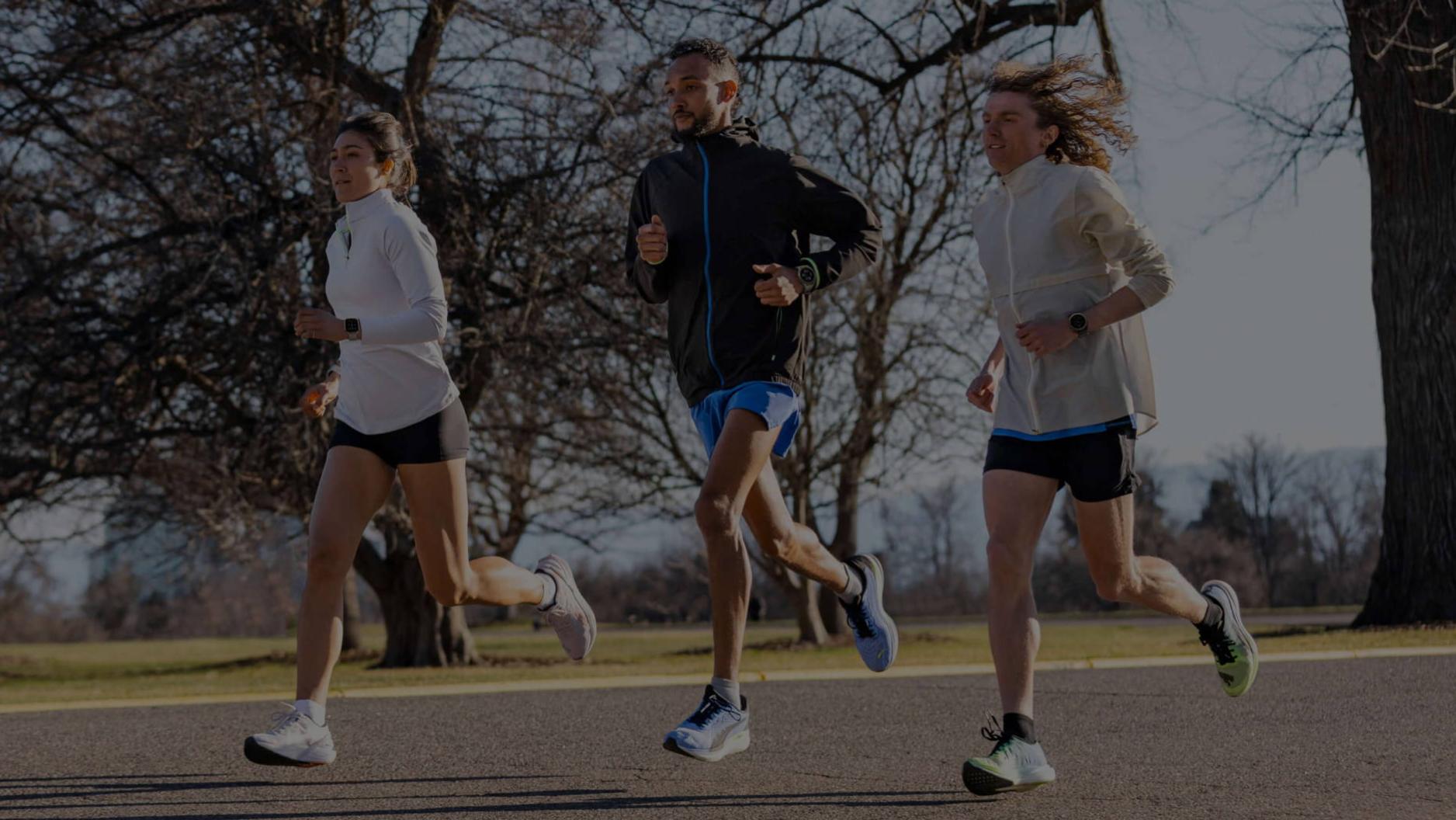 Amazfit Performance Series_Three People Running on Tarmac Road