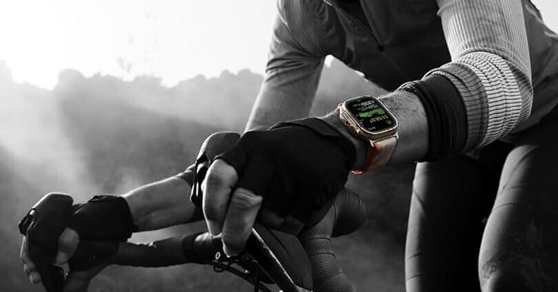 Cyclist wearing Apple Watch Ultra