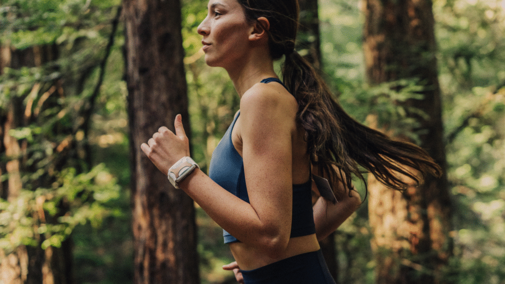 Apollo Wearable Improve Focus and Performance Woman Running in the Woods