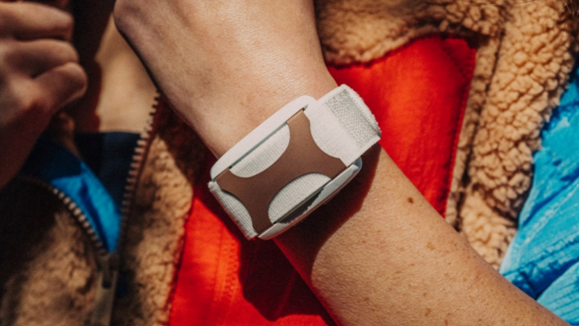 Person wearing Apollo wearable device to track health and fitness