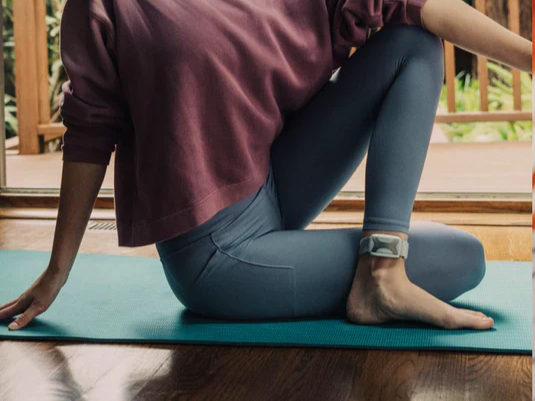 Person using Apollo Neuro wearable during a focused work session to enhance concentration and productivity